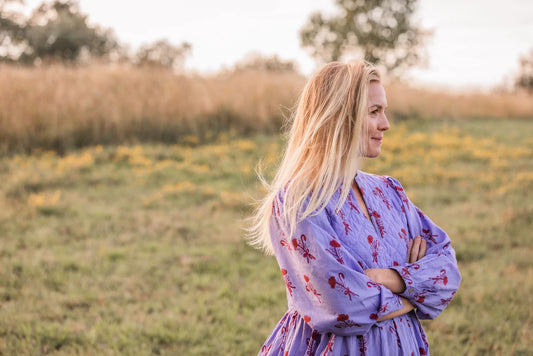 Woman in a field looking off to the side